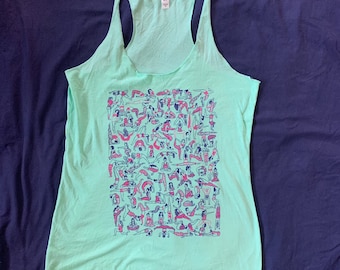 May include: Mint green racerback tank top featuring a graphic of numerous yoga poses in pink and blue. The tank top is made of a soft material and has a relaxed fit, perfect for workouts or casual wear.