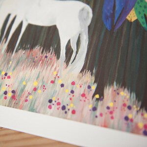 May include: A white horse stands in a field of pink, yellow, and purple flowers. The horse is painted in a simple style, with a dark green background.