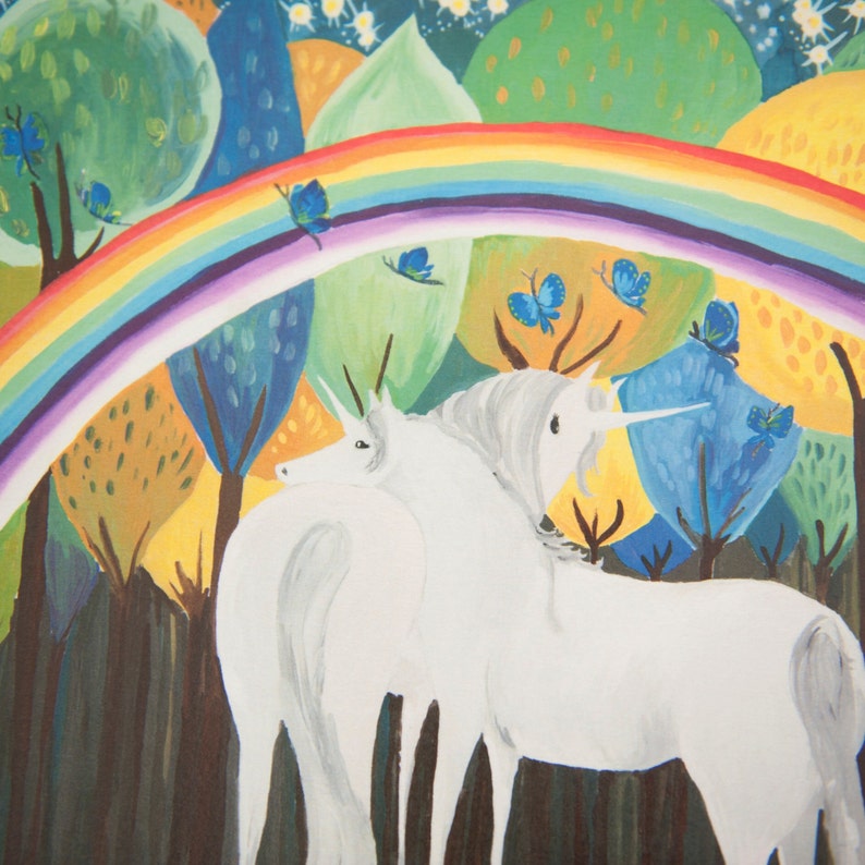 May include: Two white unicorns with silver horns stand in a whimsical forest setting. A rainbow arches over the unicorns, and butterflies flutter around them. The background is painted in bright colors, including green, blue, yellow, and purple.