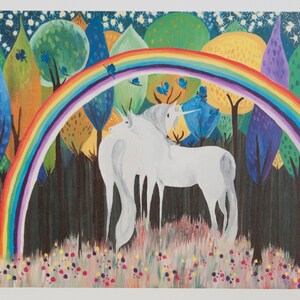 May include: Two white unicorns stand in a forest with a rainbow arching over them. The forest is filled with colorful trees and blue butterflies.