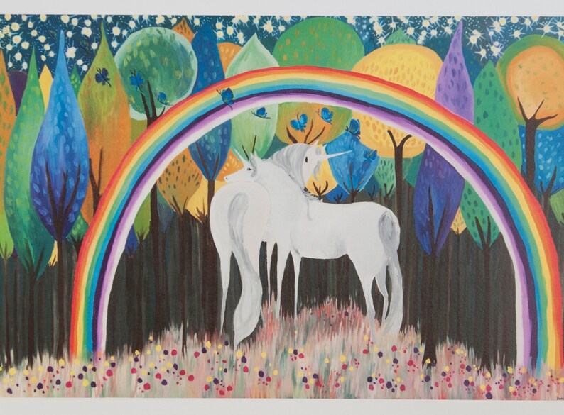May include: Two white unicorns stand in a forest with a rainbow arching over them. The forest is filled with colorful trees and blue butterflies.