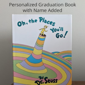 May include: A hardcover book with the title "Oh, the Places You'll Go!" by Dr. Seuss. The cover features a colorful illustration of a figure on a striped structure. The text "Personalized Graduation Book with Name Added" is at the top.