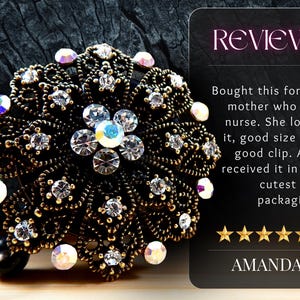 a decorative piece of jewelry with a floral design and numerous sparkling gemstones, including diamonds and crystals. The jewelry appears to be a brooch or a headband, and it is displayed against a dark background. The image also includes a review from Amanda, who loved the piece and received it as a gift in the cutest packaging.