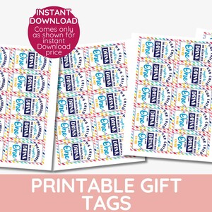 May include: Printable gift tags with a rainbow striped background and the text "It's a celebration, so you can drink one!" in blue and white text. The tags are 5.1 x 8.9 cm.