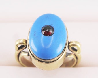 A beautiful turquoise/garnet memento mori/locket ring