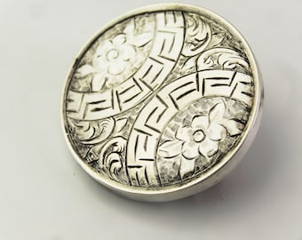 Art-deco massief zilveren broche: bloemdessin uit de jaren 1920