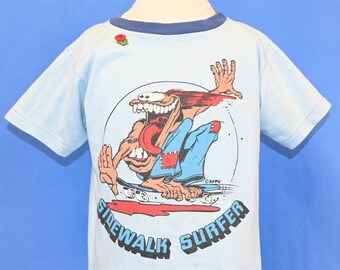 70s Sidewalk Surfer Skateboard Cartoon Skater A&PU Rose t-shirt Youth Large