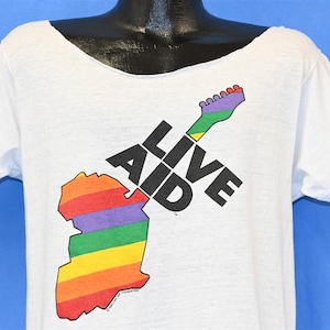 80s Live Aid This Shirt Saves Lives 1985 Benefit Concert Africa London Philadelphia Cut Neck t-shirt Medium