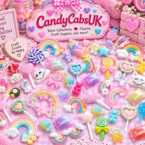 May include: A collection of colourful resin cabochons featuring rainbows, lollipops, hearts, stars, and candy-shaped charms with the text 'Sweet'. A sign displays 'CandyCabsUK', 'Resin Cabochons', 'Charms', 'Craft Supplies and more!' with hearts.