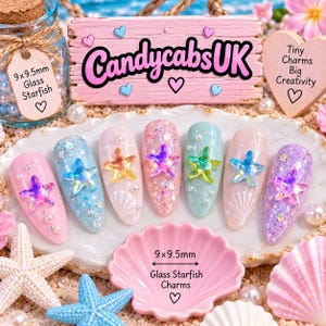 May include: Seven almond-shaped artificial nail tips decorated with glitter, small pearls, and 9x9.5mm glass starfish charms. The display includes a wooden sign with the text CandycabsUK, Tiny Charms Big Creativity, and 9x9.5mm Glass Starfish Charms.