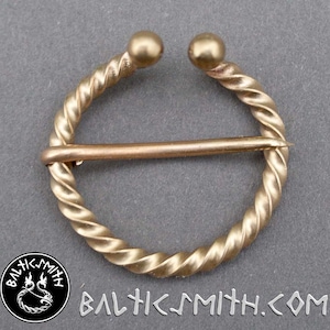 Small twisted penannular brooch in bronze