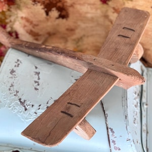 Vintage wood toy airplane handmade old folk art wooden plane