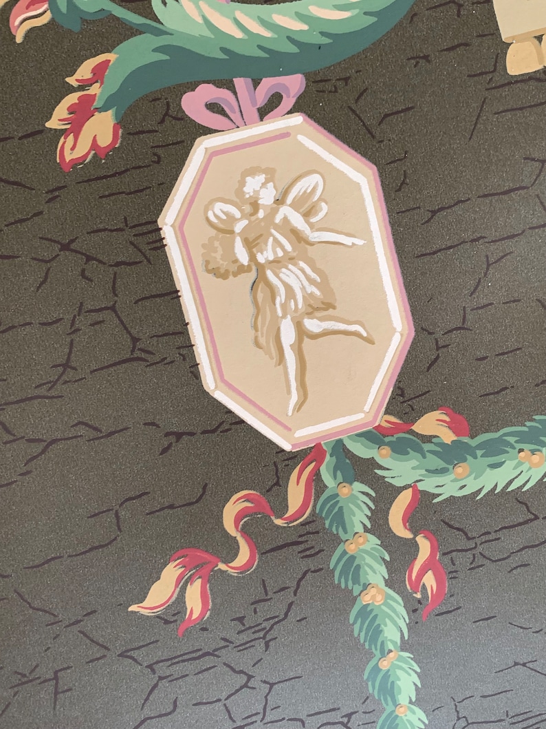 May include: A vintage wallpaper design featuring a green, pink, and yellow floral motif with a central octagonal panel depicting a white fairy with wings. The background is a dark green with a cracked texture.