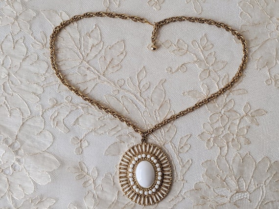 Vintage pendant necklace gold toned metal white r… - image 1