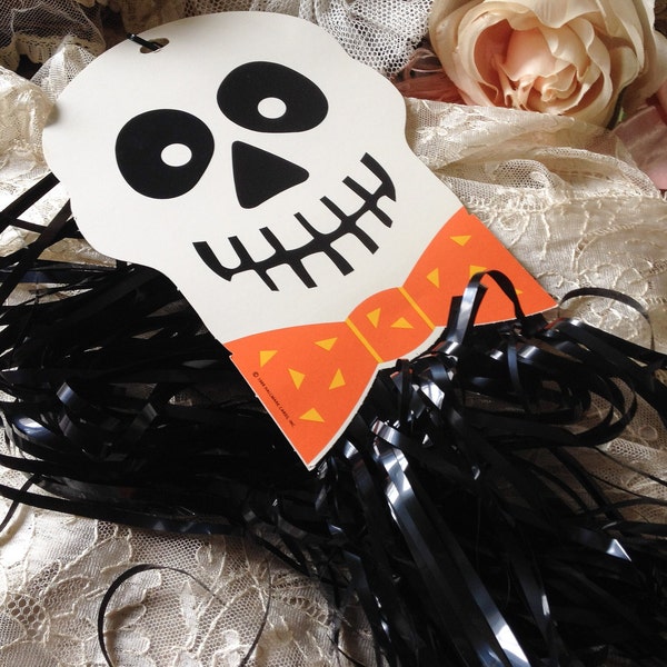 Vintage skull Halloween decoration 80s Hallmark skeleton face wind dancer hanging streamers