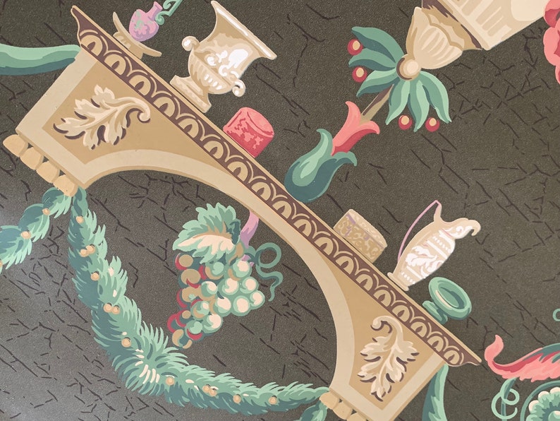 May include: A vintage wallpaper design featuring a brown background with a decorative archway, a grapevine, and a vase with flowers. The archway is decorated with a brown and white pattern. The grapevine is green and has a cluster of grapes. The vase is white and has a floral design.