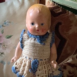 Vintage small composition baby doll with blue eyes and crochet dress 8.75 inch tall