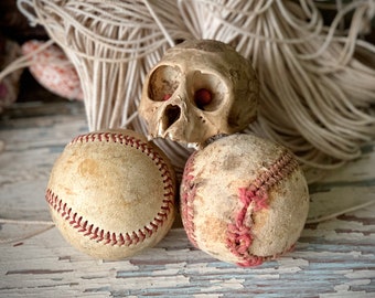 Vintage pair well used baseballs old age worn shabby leather game balls sports decor display props