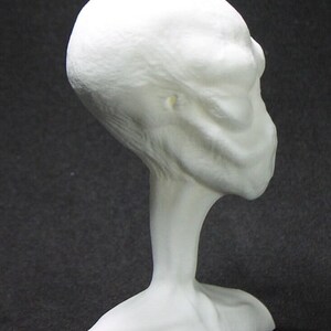 Alien bust with teal LED