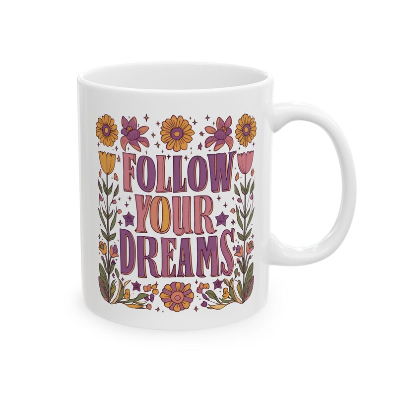 the 11 oz version of a floral boho ceramic mug with the text 'Follow Your Dreams'
