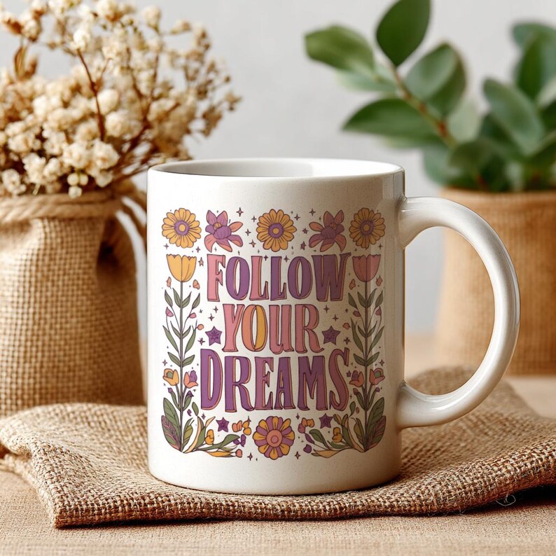 a floral boho ceramic mug with the text 'Follow Your Dreams'