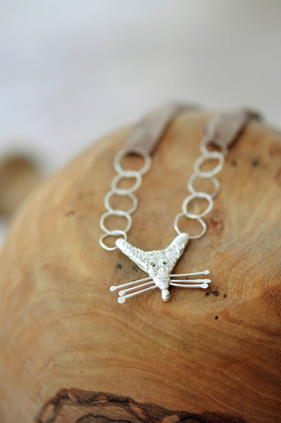 A handcrafted silver rat necklace that leans fully into oddity-core — the kind of statement piece that starts conversations and signals serious personality.