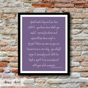 May include: A framed print with a black border. The print features a purple background with white cursive text quoting Ralph Waldo Emerson. The text reads, "finish each day and be done with it..." The bottom left corner has the text "Alexis Scott DESIGNS."