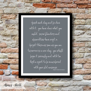 May include: A framed print with a gray background and white script. The text is a quote by Ralph Waldo Emerson, set against a black frame. The bottom left corner has the text "Alexis Scott Designs".