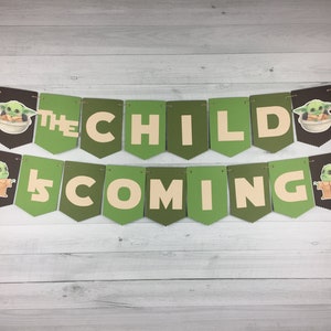 May include: Green and beige banner with the text "The Child is Coming" and images of a green alien character.