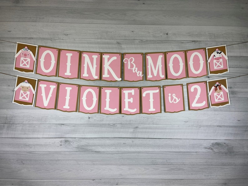 May include: Pink and brown banner with farm animal illustrations and the text "OINK  Moo  VIOLET is 2".