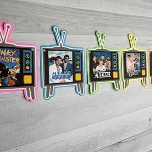 May include: A colorful banner with six retro television images. Each television has a different show from the 1980s, including Punky Brewster, Miami Vice, The A-Team, The Golden Girls, and I Love the 80s.