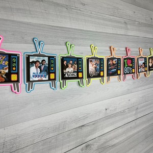 May include: A banner of 10 colorful retro television sets with images of popular 80s shows, including Punky Brewster, Miami Vice, A-Team, The Golden Girls, and I Love the 80s.