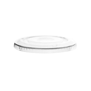 May include: A clear plastic lid for a cup or container. The lid has a smooth, flat surface and a slightly raised edge around the perimeter.