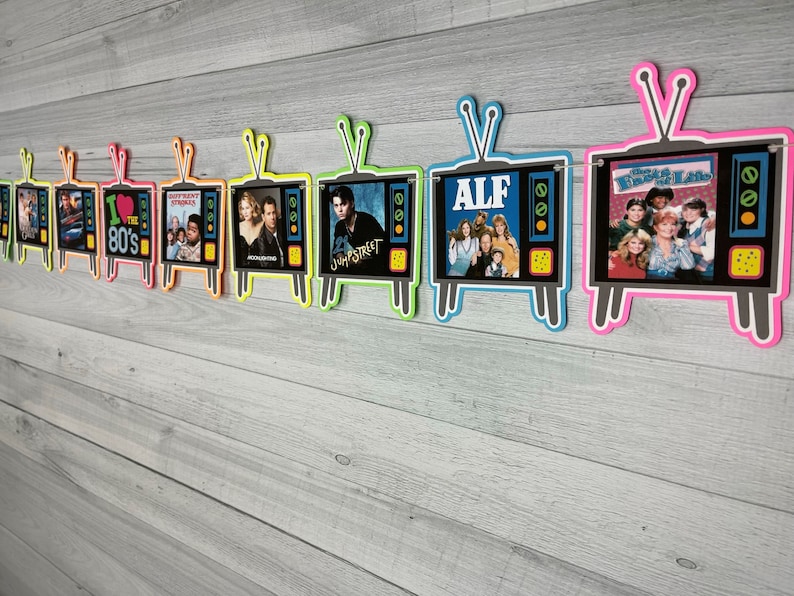 May include: A colorful banner with 8 retro TV-shaped cutouts featuring images from popular 1980s shows, including "ALF", "The Facts of Life", "Jump Street", "Different Strokes", and "I Love the 80's".