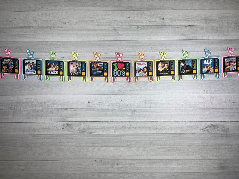 May include: A colorful garland of 10 retro television screens with images of popular 1980s movies and TV shows, including "Punky Brewster", "ALF", and "The Breakfast Club". The garland is perfect for a 1980s themed party or event.