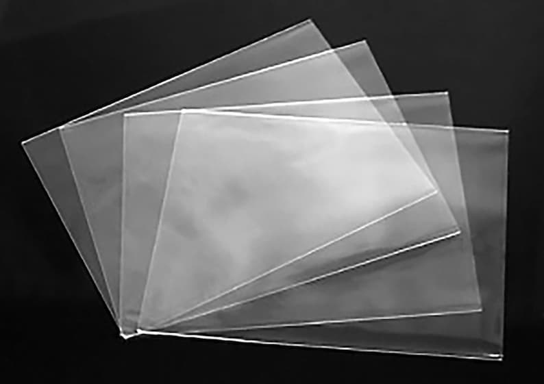 May include: A stack of clear plastic bags, ideal for packaging small items.