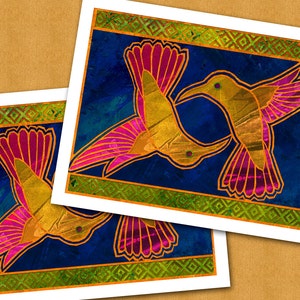 May include: Two stylized hummingbirds with pink and yellow wings against a dark blue background. The birds are facing each other with their beaks touching. The background is framed with a green and gold geometric pattern.