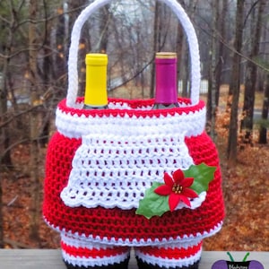 May include: Crocheted Santa Claus wine bottle holder with a white handle, red and white striped legs, and a red and white skirt with a green holly leaf and red poinsettia.