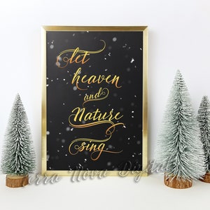May include: A gold framed print with a black background and white snowflakes. The print features the text "Let heaven and nature sing" in gold script.