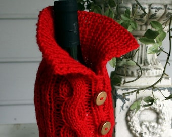 Dress your table with love with this cabled Wine Cozy in a beautiful cherry red with gold buttons