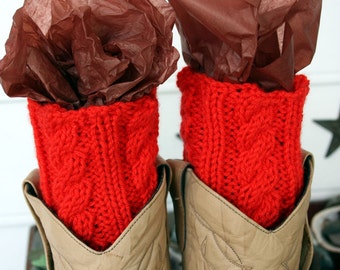 Orange Boot Cuffs with a beautiful cabled pattern.  A great add-on to dress up your boots.