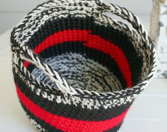 This adorable hand chrocheted basket is made with black, white and red. Items in basket not included