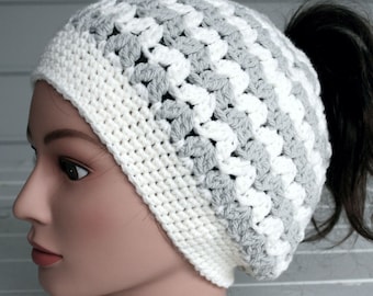This toboggan opens at the top for your pony tail.  Gray and white stripes crocheted with thick and soft yarn