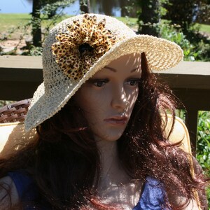 Large Brim Hat the color of straw.  Not a floppy hat, this hat is wired at the brim to keep a beautiful profile.