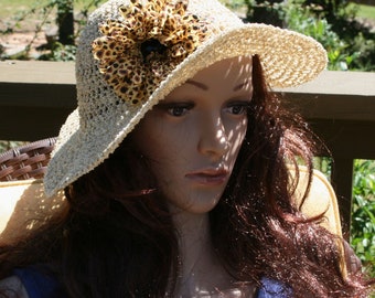 Large Brim Hat the color of straw.  Not a floppy hat, this hat is wired at the brim to keep a beautiful profile.