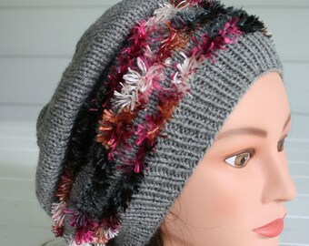 Slouchy Hat made for the holidays.  A beautiful soft gray yarn with rows of hot pink and black fringe yarn