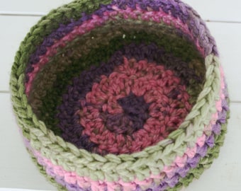 Pinks Purples and Greens make this basket a garden delight.  Hand Crocheted with a thick soft yarn