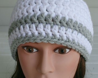 Stay warm this winter with this thick and cozy beanie style hat.  Gray and White stripes crocheted with thick soft yarn.