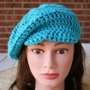 Hand crocheted Newsboy hat.  Crocheted with a Super Soft Turquoise Yarn