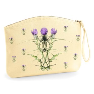 Bolso de mano con estampado de cardos y cremallera floral